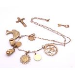 A collection of 9ct gold (all hallmarked) to include Star Of David, Cross, St. Christopher etc,