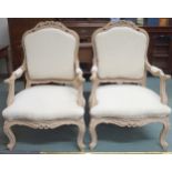 A pair of contemporary painted parlour armchairs with cream wool upholstery, 110cm high x 71cm