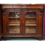 A Victorian mahogany two door glazed bookcase on bracket feet, 95cm high x 106cm wide x 35cm deep