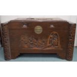 A 20th century Oriental camphorwood blanket chest with carved lid and front facing, 58cm high x