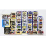 A large collection of boxed die-cast scale model vehicles, largely advertising vans by Oxford