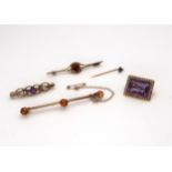 A yellow metal amethyst and pearl brooch, two 9ct gold brooches, a yellow metal citrine brooch and a