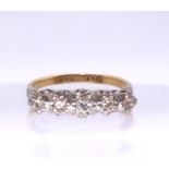 An 18ct gold five diamond star set ring, finger size R1/2, weight 3.2gms Condition Report: