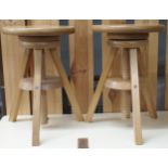 A pair of contemporary beech adjustable sculpture stands, 46cm high x 31cm diameter and a pine frame