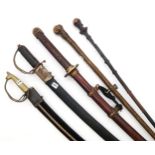 A decorative Japanese katana, two Indian sabres, a thornwood walking cane and a further example (