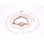 A 9ct gold ladies Rotary watch, a 9ct gold wire chain pearl necklace, and a string of pearls with