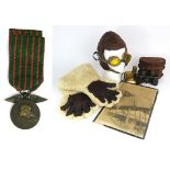 WW1-ERA FLYING APPAREL  Comprising a pair of large sheepskin gauntlets, yellow-lensed goggles with