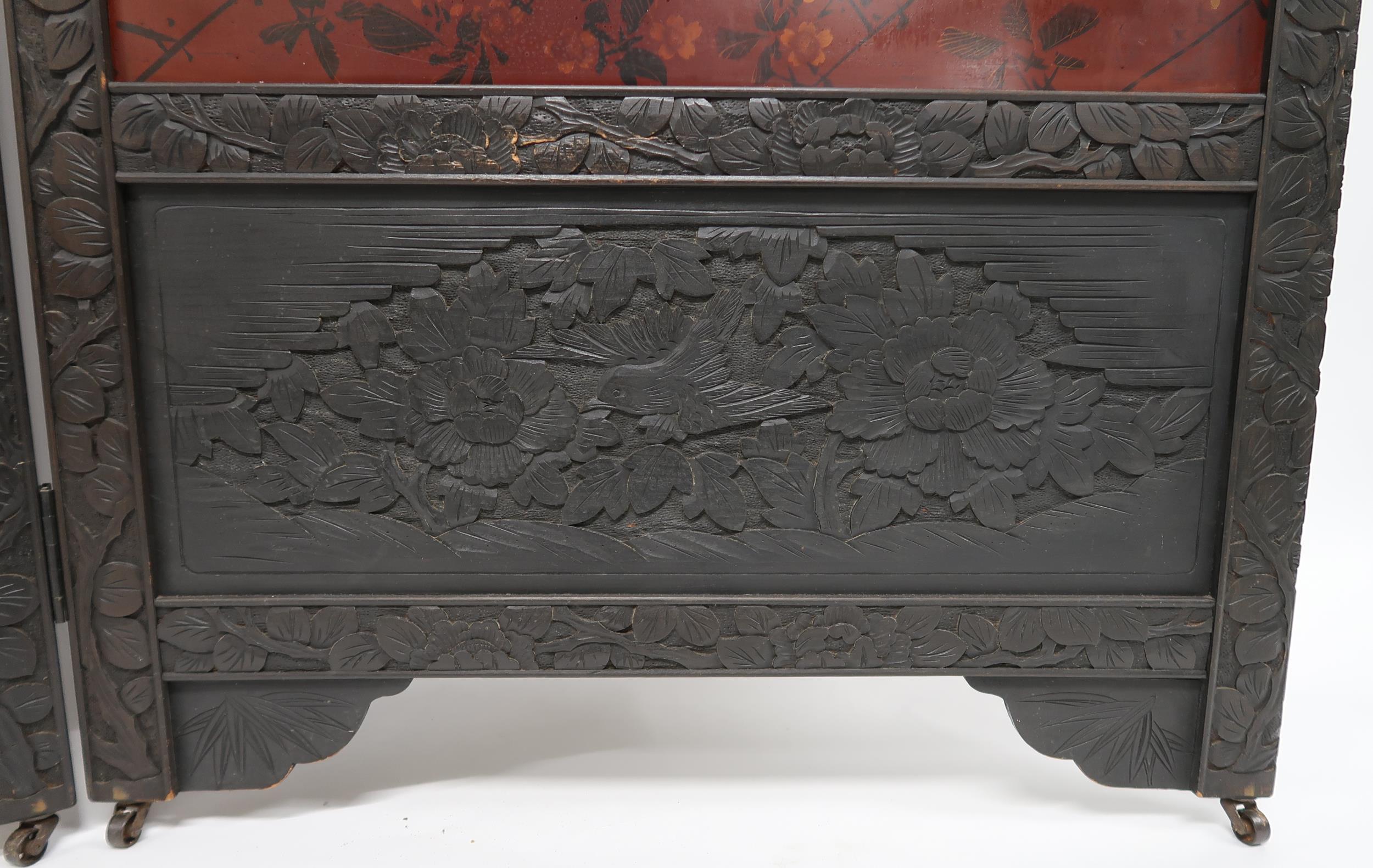 AN ORIENTAL HARDWOOD FRAMED LACQUERED TWO FOLD ROOM DIVIDER with foliate carved frame surrounding - Image 12 of 17