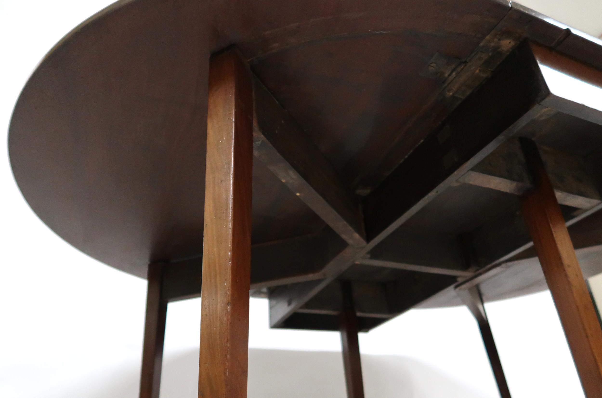 A VICTORIAN MAHOGANY DROPLEAF TABLE  with oval drop leaf top on square tapering supports terminating - Image 6 of 10