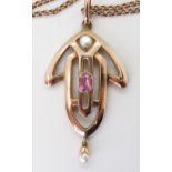 AN EDWARDIAN ROSE GOLD PENDANT set with pearl & pink tourmaline, stamped indistinctly 9ct, with