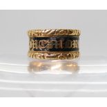 AN ENAMELLED MOURNING RING with full 18ct gold hallmarks for London 1831, the inscription reads,