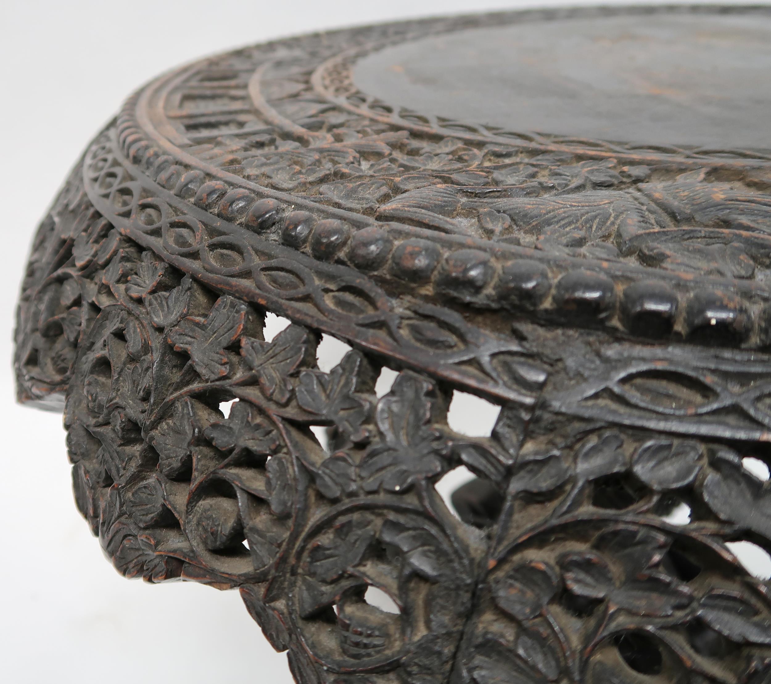 AN ANGLO-INDIAN TILT TOP CIRCULAR TABLE with extensively pierced carved foliate table apron over - Image 5 of 9