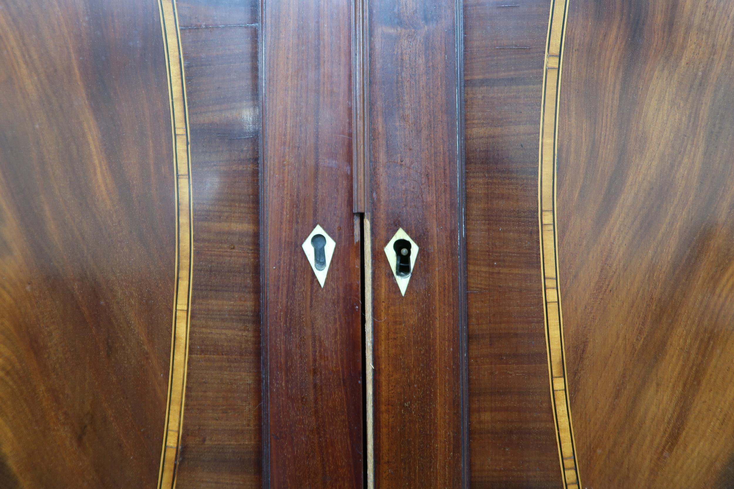 A GEORGIAN MAHOGANY LINEN PRESS  with moulded cornice over pair of satinwood inlaid panel doors - Image 10 of 10