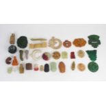 A COLLECTION OF CHINESE HARDSTONE PENDANTS AND PLAQUES Together with two seals, cup, frog, cicada,