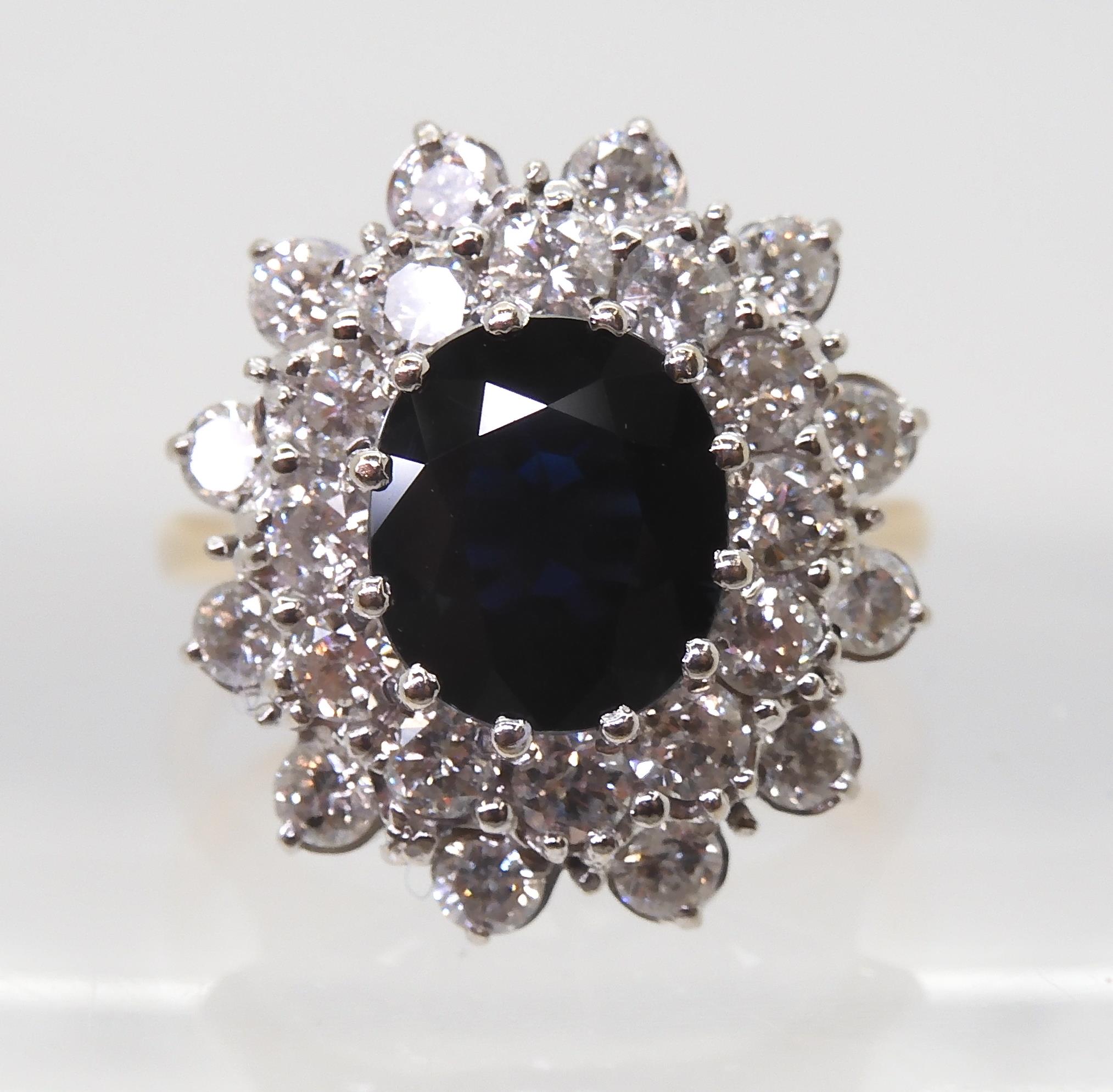 A SAPPHIRE AND DIAMOND CLUSTER RING the 16.8mm x 18mm cluster, mounted throughout in yellow and - Image 2 of 8