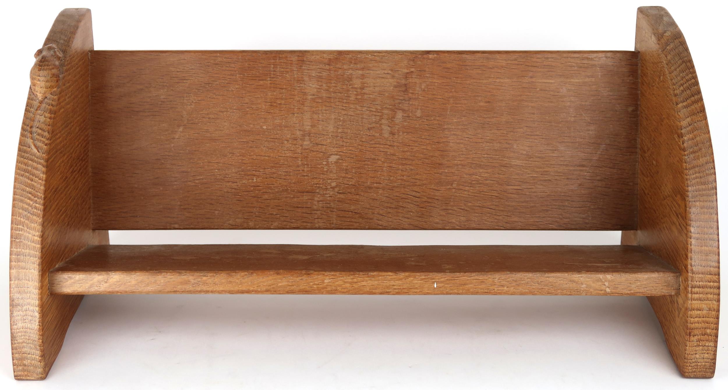 A ROBERT "MOUSEMAN" THOMPSON OAK BOOK TROUGH  with curved adzed end supports carved with signature