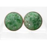 A PAIR OF CHINESE GREEN HARDSTONE EARRINGS carved with foliage and set in 9ct gold stud earring