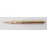 AN ASPREYS PROPELLING PENCIL made in 9ct gold with full Asprey's hallmarks for 1928, engraved with