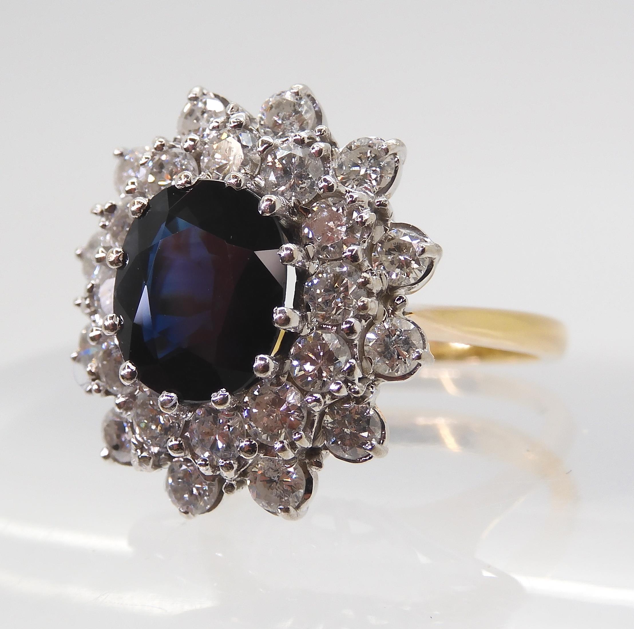 A SAPPHIRE AND DIAMOND CLUSTER RING the 16.8mm x 18mm cluster, mounted throughout in yellow and - Image 5 of 8