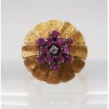 AN ITALIAN RETRO FLOWER CLUSTER RING set with rubies and a diamond, mounted throughout in 18ct