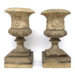 A PAIR OF SCOTTISH 19TH CENTURY FIRECLAY GARDEN URNS ON SQUARE PLINTH BASES with moulded acanthus