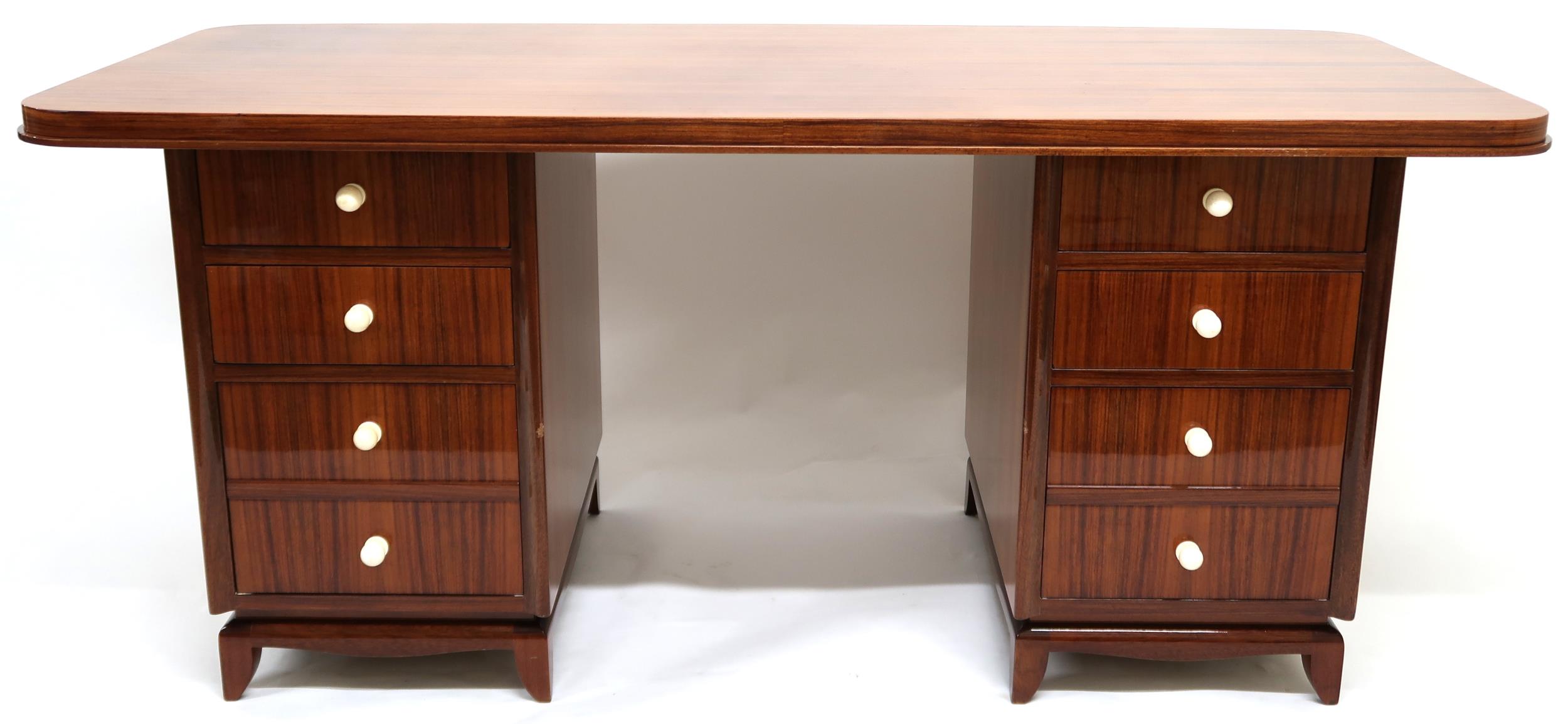 A LATE 20TH CENTURY ART DECO STYLE TWIN PEDESTAL DESK with shaped top on pair of four