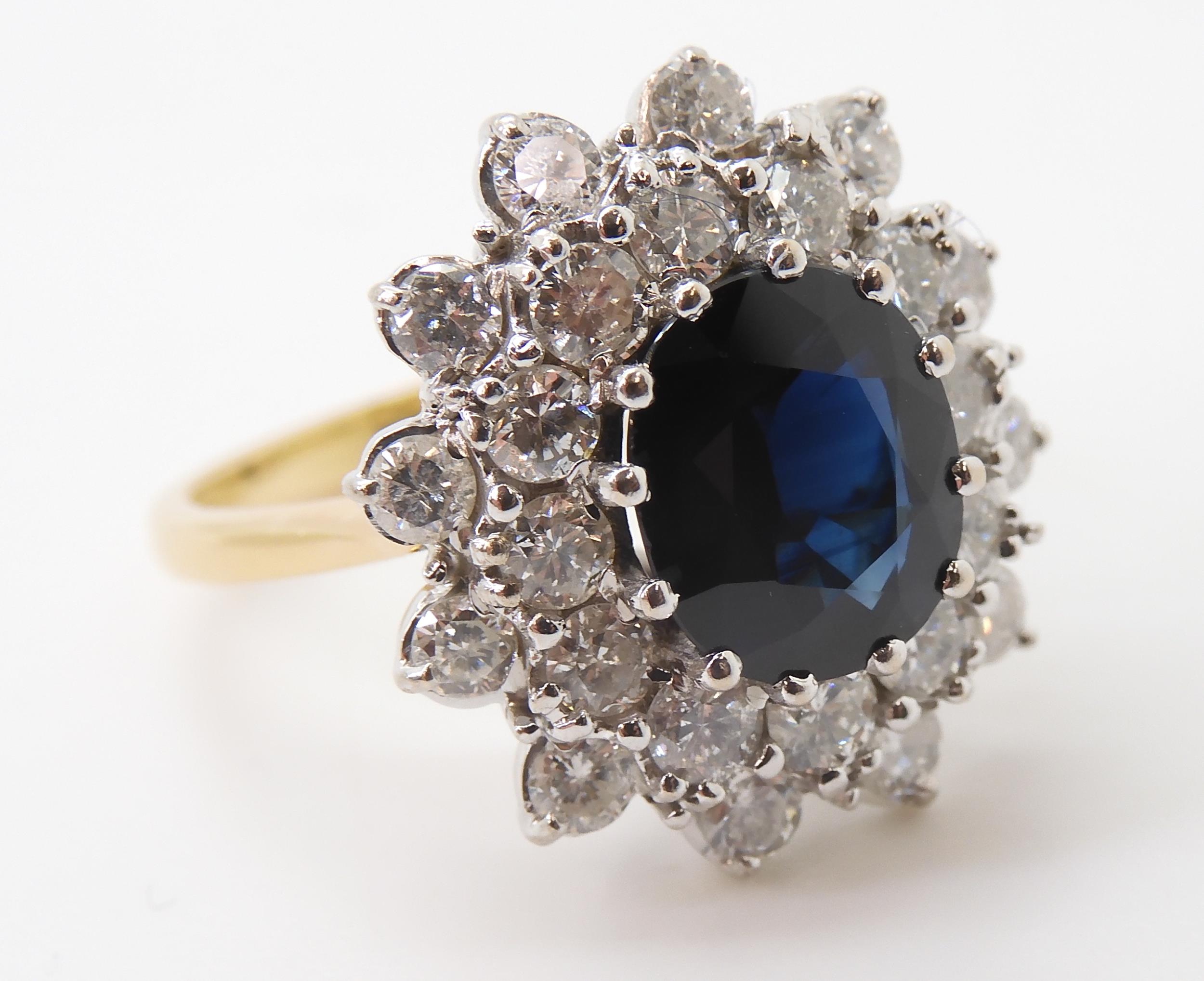 A SAPPHIRE AND DIAMOND CLUSTER RING the 16.8mm x 18mm cluster, mounted throughout in yellow and - Image 7 of 8