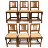 A SET OF SIX PETER "RABBITMAN" HEAP OAK LATTICE BACK DINING CHAIRS with carved lattice splat over