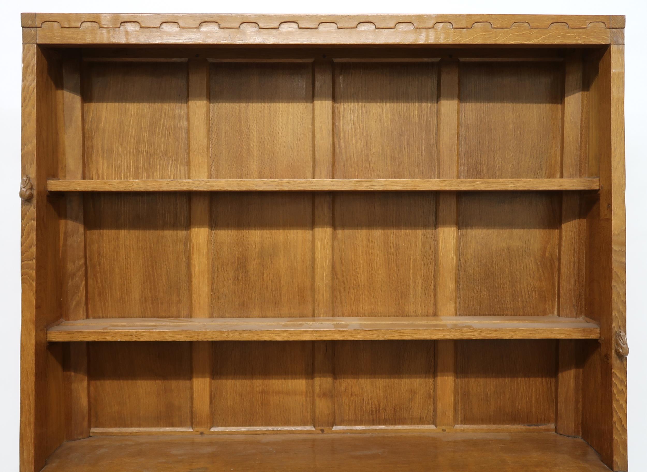 A PETER "RABBITMAN" HEAP OAK KITCHEN DRESSER with cornice carved with key design over two open plate - Image 3 of 13