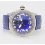 A CORUM BOUTIQUE WATCH in stainless steel and white gold with a cobalt blue metallic dial, eccentric