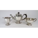 A GEORGE V THREE PIECE IRISH SILVER TEA SERVICE by George Edward & Sons, Dublin 1923, of baluster