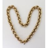 A 9CT GOLD CHIAMPESAN FANCY CHAIN with hollow puffed links, and a sapphire cabochon set to the clasp