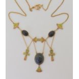 AN EGYPTIAN REVIVAL NECKLACE made in gilded white metal, with plique a jour enamel ankhs and lotus