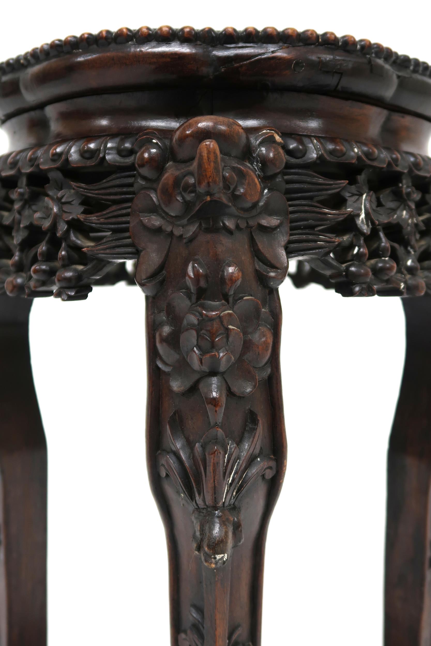 A CHINESE HARDWOOD JARDINERE STAND  with shaped top inset with pink marble over floral carved - Image 6 of 9