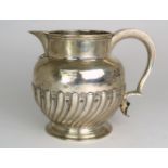 **WITHDRAWN** A GEORGE IV SILVER JUG by Thomas Savory Cox, London 1829, of swollen baluster form, th