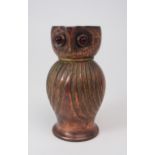 AN ARTS AND CRAFTS COPPER JUG in the form of an owl, with red glass eyes, 16cm high Condition