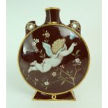 A MINTON ART STUDIO POTTERY MOON FLASK painted to one side with a bird amongst wisteria, and with