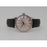 A LONGINES AUTOMATIC CONQUEST with a silvered dial gold coloured dagger numerals and hands, with