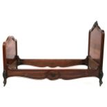 A PAIR OF 19TH CENTURY FRENCH ROSEWOOD SINGLE BED FRAMES  with shaped headboards topped with