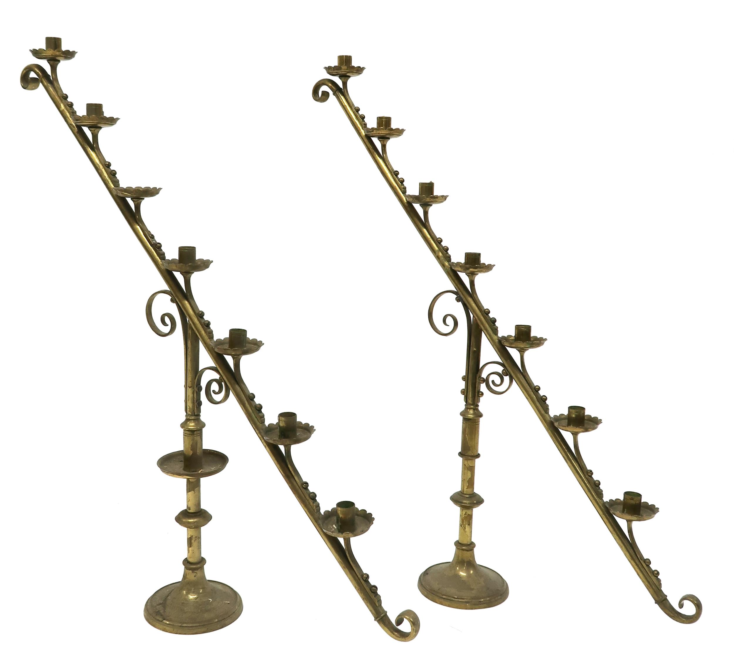 A PAIR OF 19TH CENTURY BRASS ECCLESIASTICAL SLOPED CANDELABRA each with seven candle holders with - Image 2 of 6