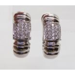 A PAIR OF ITALIAN MADE DIAMOND EARRINGS made in 18k white gold and pave set with estimated approx