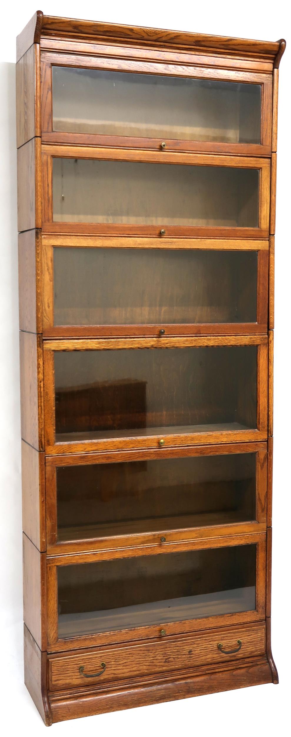 AN EARLY 20TH CENTURY OAK GLOBE-WERNICKE STYLE SIX TIER SECTIONAL BOOKCASE with six glazed doored - Image 2 of 13