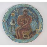 JAMES COSGROVE (SCOTTISH 1939) A CERAMIC DISH with incised decoration of a naked man sitting on a