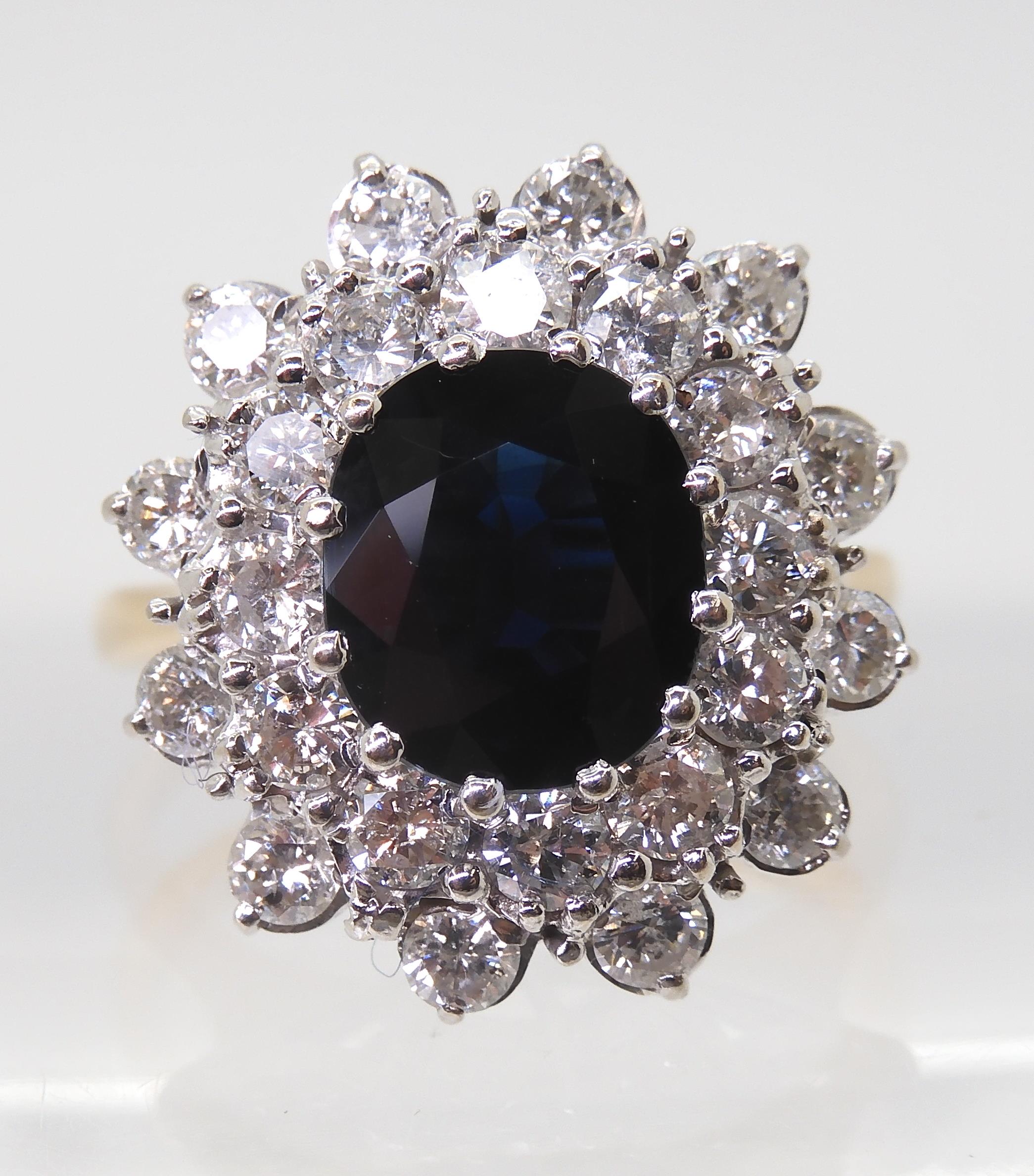 A SAPPHIRE AND DIAMOND CLUSTER RING the 16.8mm x 18mm cluster, mounted throughout in yellow and