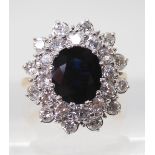 A SAPPHIRE AND DIAMOND CLUSTER RING the 16.8mm x 18mm cluster, mounted throughout in yellow and