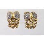 ITALIAN 18CT GOLD DIAMOND EARRINGS with a decorative knot pattern, pave set with estimated approx
