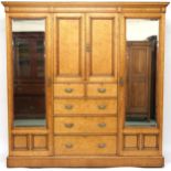 A VICTORIAN BIRDSEYE MAPLE COMPACTUM WARDROBE & ACCOMPANYING BEDSIDE CABINET wardrobe with moulded