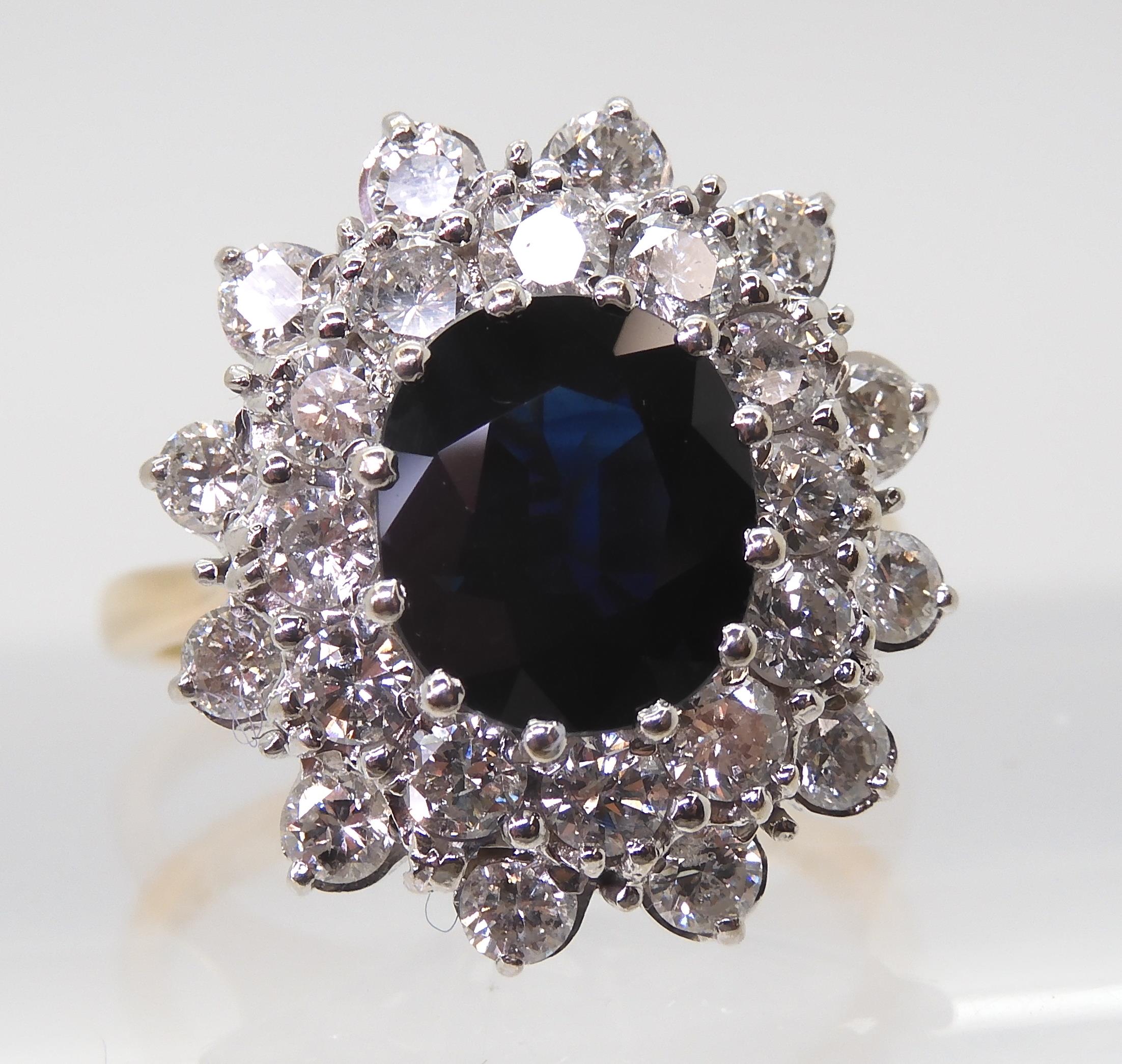 A SAPPHIRE AND DIAMOND CLUSTER RING the 16.8mm x 18mm cluster, mounted throughout in yellow and - Image 4 of 8