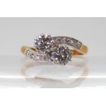A CLASSIC TWIN STONE DIAMOND RING mounted in 18ct yellow gold and platinum, set with estimated