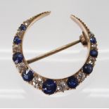 A SAPPHIRE & DIAMOND MOON BROOCH set throughout in yellow metal with galleried mount, in original